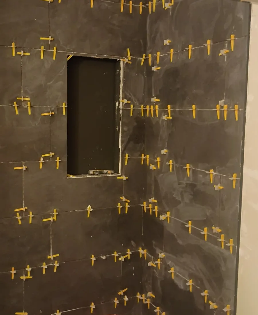 Bathroom tile installation in progress